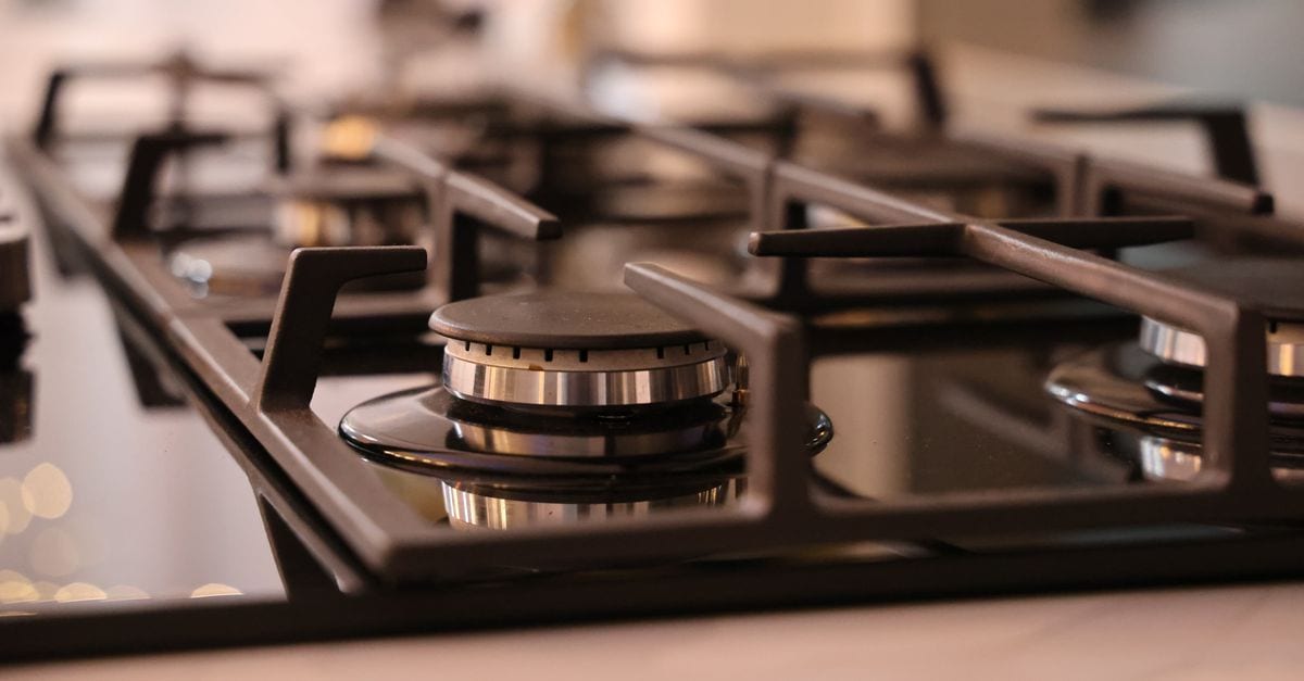 Gas appliance installation — new gas cooktop connected and tested in a Sydney kitchen
